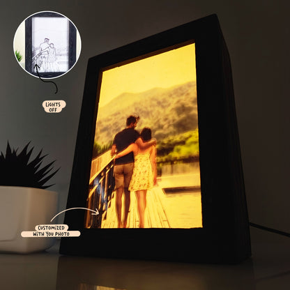 A Custom Photo Light Box showing a couple on a bridge with mountains in the background. Inset image displays the photo when the lamp is off. Caption labels: "Lights off" and "Customized with your photo.